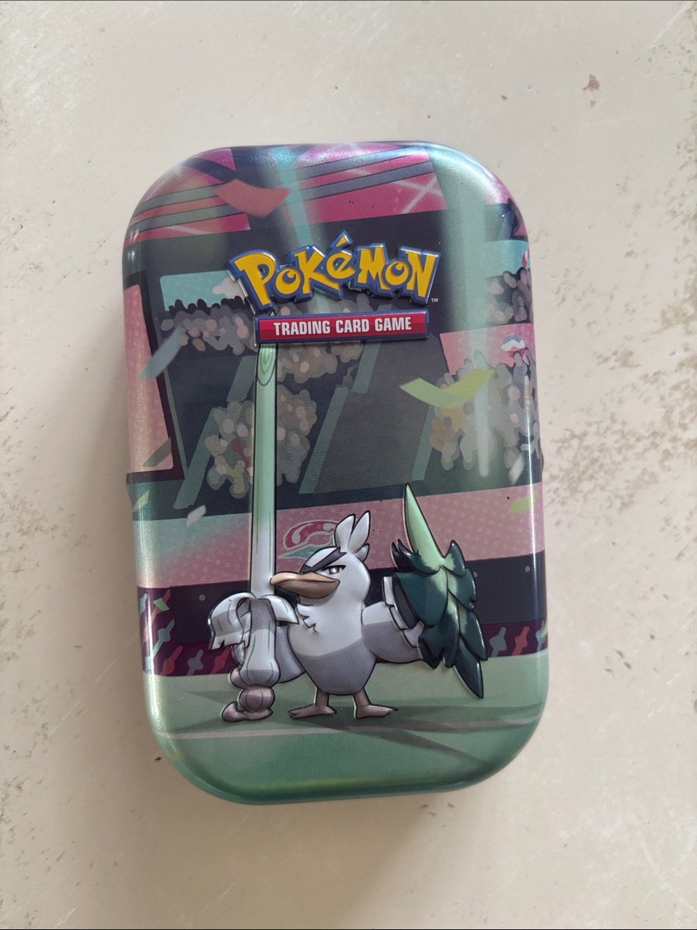Pokemon tin with 32 cards inside